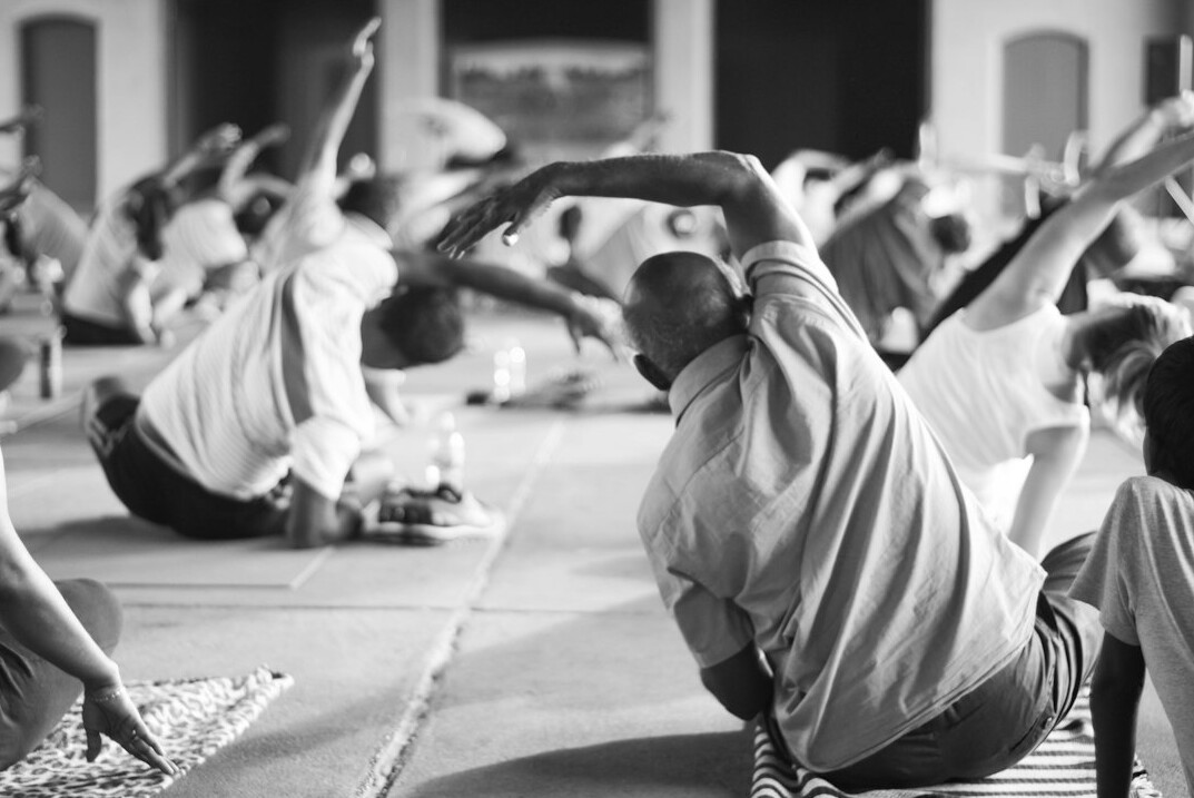 employees doing yoga together
