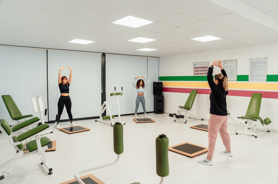 Employees stretching together during an office wellness break