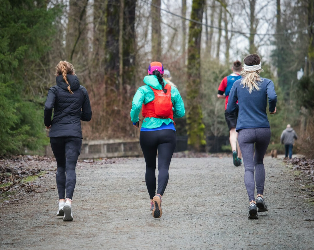 group of colleagues running outdoors